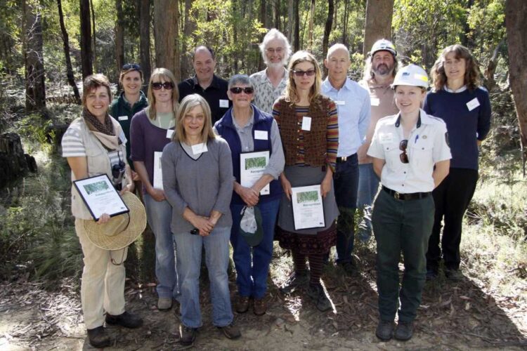 Wombat Forestcare members receive a Certificate of Recognition from DSE